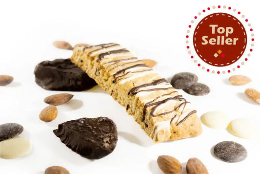 Chocolate Almond Biscotti - Top Seller . Biscotti drizzled with white and dark chocolate. Shown with chunks of chocolate, whole almonds and white and chocolate chips.