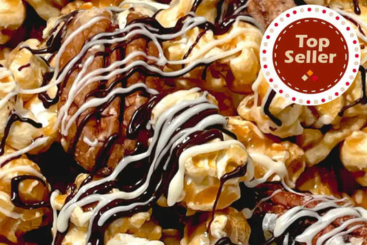 Ultimate Popcorn - Top Seller. Fresh caramel popcorn with candied pecans.  drizzled with white and dark chocolate